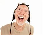 Laughing senior man on white background in knit cap