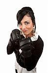 Beautiful Hispanic businesswoman smiling with boxing gloves