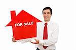 Real estate agent holding house shaped for sale sign