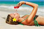 Girl with flower on caribbean beach