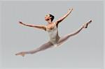 Proffessional female ballet dancer isolated in studio