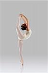 Proffessional female ballet dancer isolated in studio