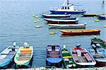 Many small fishing boats anchored on Danube river in Belgrade