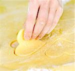 Making heart shaped shortbread cookies by hand