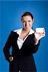 Portrait of a beautiful and young businesswoman holding a business card