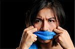 Girl gagged with blue scarf pulls to free her voice