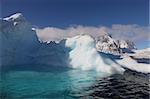 Iceberg with pool in Antarctica seen from a sailing boat