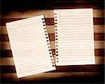 Writing note paper on wood background