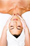 Close-up of a beautiful young woman getting a massage.