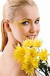 beauty portrait of young cute blond girl with colored make up and some yellow flowers