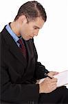 Closeup of a business man writing down with notepad on a white background