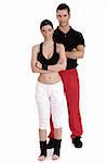 Fitness couple posing to camera on isolated white background