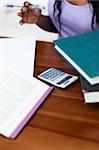 Close-up of a student doing her homework at home