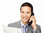 Positive businessman on phone holding a newspaper against a white background