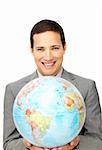 Attractive businessman holding a terrestrial globe isolated on a white background