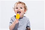 Portrait of Boy Eating Ice Cream Treat