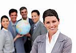 Ambitious business team holding a terrestrial globe against a white background