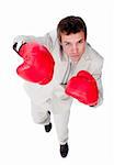 Competitive businessman using boxing gloves isolated on a white background