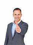 Cheerful businessman with thumb up smiling at the camera