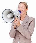 Attractive businesswoman shouting through a megaphone isolated on a white background