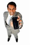 Enthusiastic businessman showing a mobile phone isolated on a white background