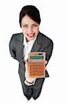 Cheerful businesswoman holding a calculator isolated on a white background