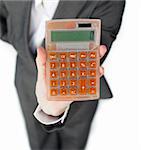 Close-up of a businesswoman holding a calculator isolated on a white background