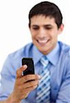 Smiling businessman sending a text against a white background