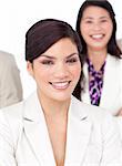 Portrait of a beautiful businesswoman and her team against a white background