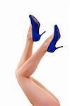 Legs and blue high heels isolated on a white background