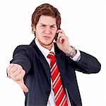 Businessman with bad news on his cell phone disapproving