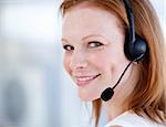 Cute sales representative woman with an headset against white background