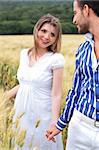 Loving couple, woman on focus in the park