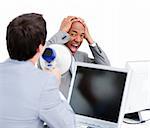 Stressed businessman yelling through a megaphone in the office