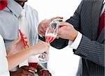 Close- up of two colleague drinking champagne to celebrate christmas in the company