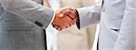 Close-up of a business agreement by shaking hand in the office