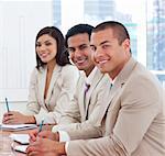 Smiling young business associates in a meeting