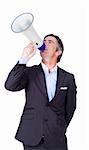 Businessman giving orders through a megaphone against a white background