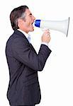 Attractive Businessman rowing through a megaphone isolated on a white background