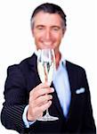 Successful businessman toasting with Champagne against a white background