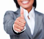 Close-up of a businesswoman with thumb up isolated on a white background