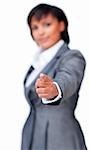 Businesswoman pointing at the camera isolated on a white background