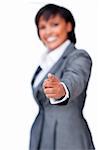 Smiling hispanic businesswoman pointing against a white background