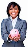 Hispanic Businesswoman holding a piggybank against a white background