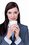 Portrait of an attractive businesswoman drinking a coffee isolated on a white background