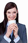Laughing businesswoman drinking a coffee isolated on a white background