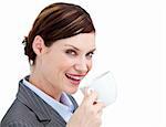 Portrait confident businesswoman drinking a cup of coffee against a white background