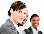 Portrait of smiling businesswoman listenning a presentation against a white background