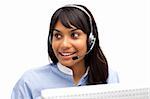 Ethnic businesswoman with headset on in a call center