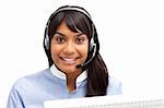 Businesswoman with headset on smiling at the camera